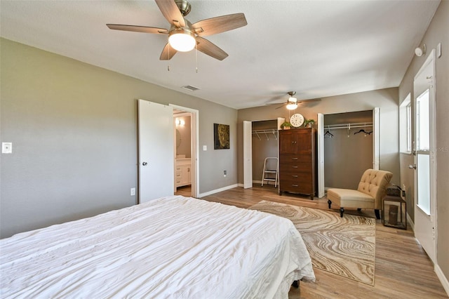 8080 112th St Unit 108, Seminole, FL 33772 - bedroom featuring two closets, wood finished floors, and a ceiling fan