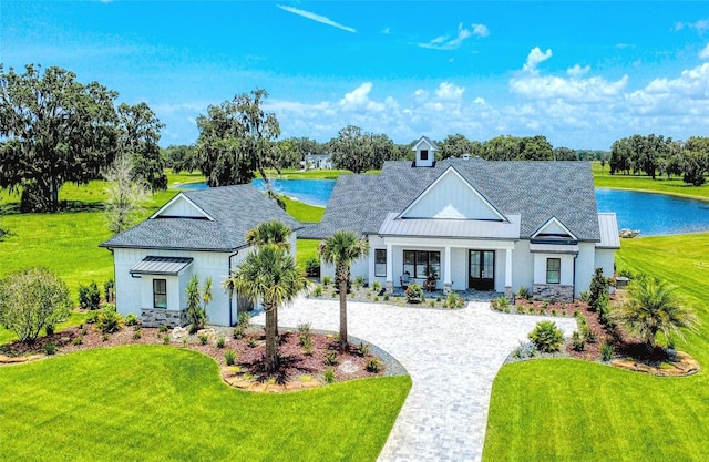 12902 SW 138th Loop, Dunnellon, FL 34432 - modern farmhouse featuring a front lawn, stucco siding, and a shingled roof