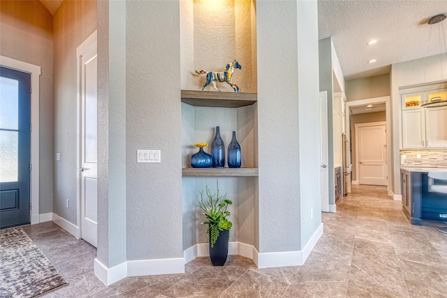 12902 SW 138th Loop, Dunnellon, FL 34432 - foyer entrance featuring a textured wall and baseboards