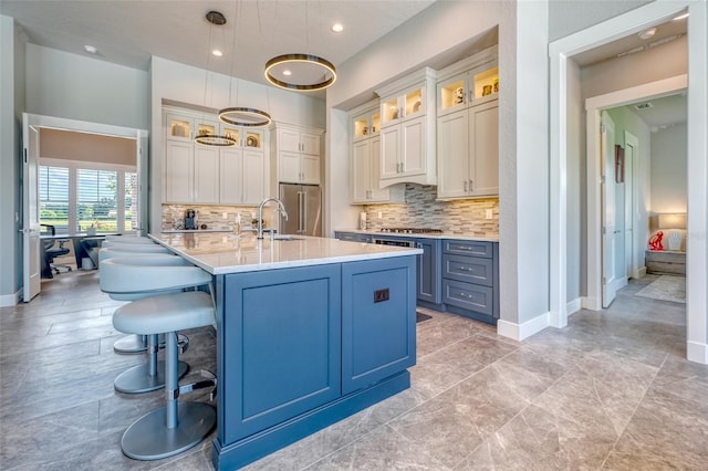 12902 SW 138th Loop, Dunnellon, FL 34432 - kitchen featuring stainless steel appliances, light countertops, backsplash, a kitchen island with sink, and recessed lighting