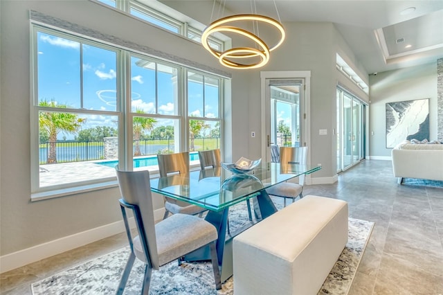 12902 SW 138th Loop, Dunnellon, FL 34432 - dining space with a chandelier and a water view