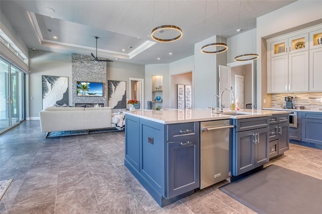12902 SW 138th Loop, Dunnellon, FL 34432 - kitchen featuring stainless steel dishwasher, white cabinets, light countertops, a center island with sink, and open floor plan