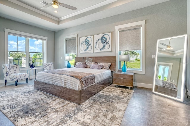 12902 SW 138th Loop, Dunnellon, FL 34432 - bedroom featuring ornamental molding, a tray ceiling, a ceiling fan, and a textured wall