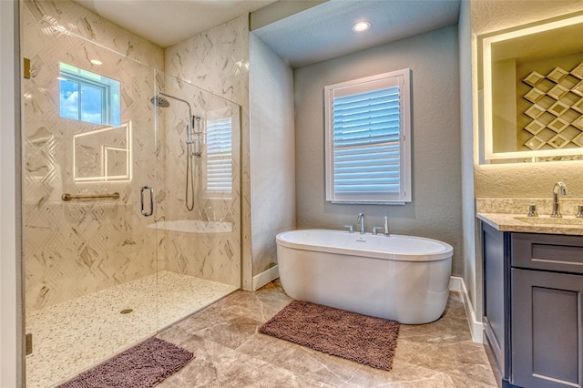 12902 SW 138th Loop, Dunnellon, FL 34432 - bathroom featuring a stall shower, a soaking tub, and vanity