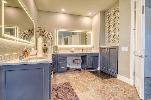12902 SW 138th Loop, Dunnellon, FL 34432 - bathroom featuring two vanities and recessed lighting