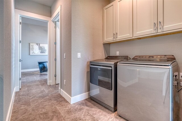 12902 SW 138th Loop, Dunnellon, FL 34432 - laundry room with cabinet space, separate washer and dryer, and a textured wall
