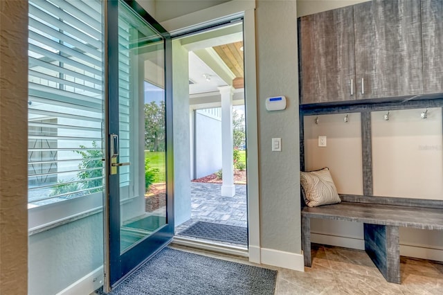 12902 SW 138th Loop, Dunnellon, FL 34432 - entryway with a textured wall, ornate columns, and tile patterned flooring