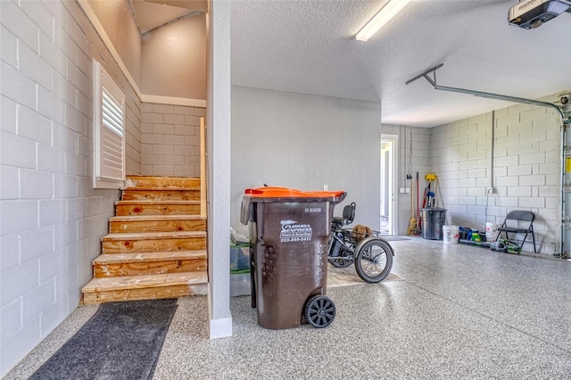 12902 SW 138th Loop, Dunnellon, FL 34432 - garage featuring concrete block wall and a garage door opener