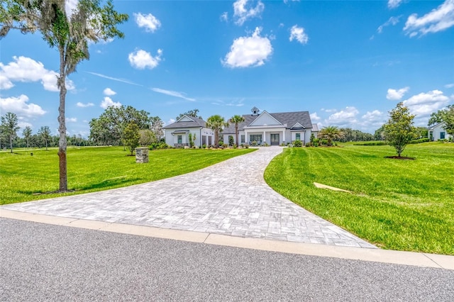 12902 SW 138th Loop, Dunnellon, FL 34432 - view of front facade featuring a front lawn and decorative driveway