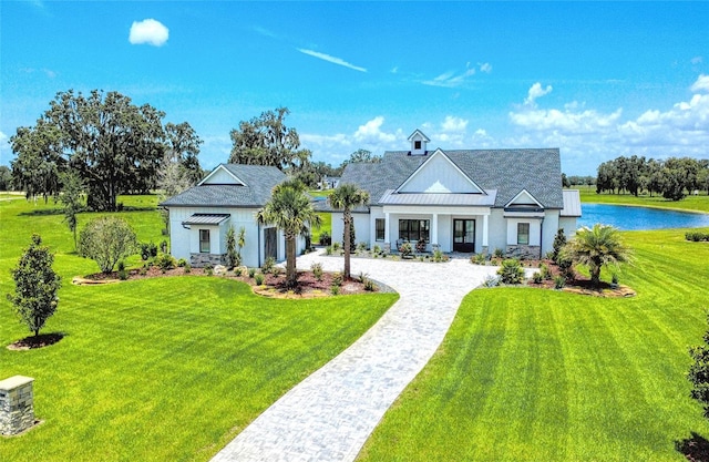 12902 SW 138th Loop, Dunnellon, FL 34432 - view of front of property with a front yard, decorative driveway, roof with shingles, and stucco siding