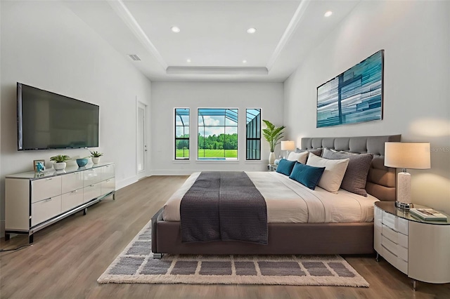 937 Old Welcome Rd, Lithia, FL 33547 - bedroom featuring wood finished floors, a raised ceiling, and recessed lighting