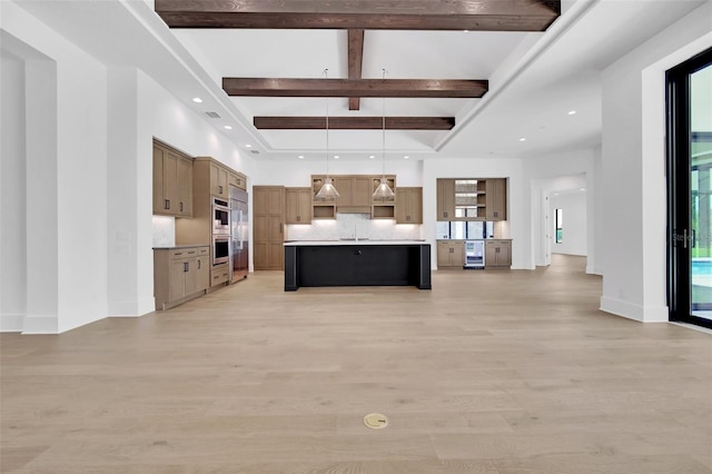937 Old Welcome Rd, Lithia, FL 33547 - kitchen featuring beverage cooler, open floor plan, beamed ceiling, light wood-style floors, and light countertops