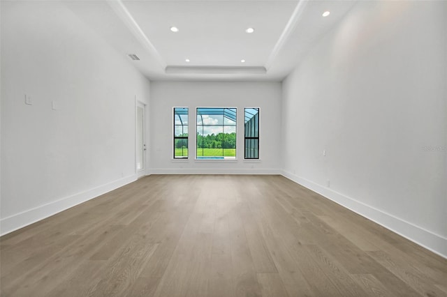 937 Old Welcome Rd, Lithia, FL 33547 - spare room featuring a tray ceiling, wood finished floors, and recessed lighting