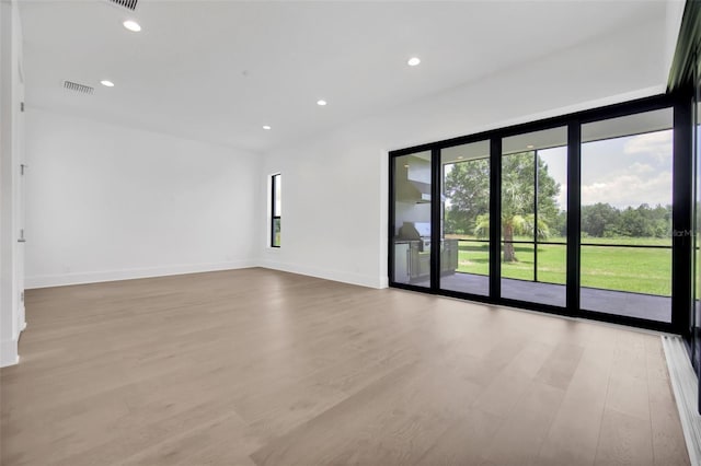 937 Old Welcome Rd, Lithia, FL 33547 - unfurnished room with light wood-style floors and recessed lighting