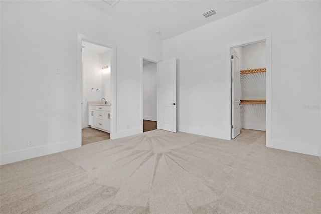 937 Old Welcome Rd, Lithia, FL 33547 - unfurnished bedroom with carpet flooring, a walk in closet, ensuite bathroom, and a closet