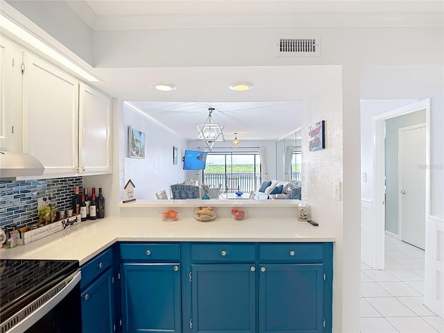 809 Bahia Del Sol Dr Unit 72, Ruskin, FL 33570 - kitchen featuring blue cabinets, electric range oven, light tile patterned floors, tasteful backsplash, and crown molding