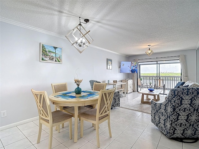 809 Bahia Del Sol Dr Unit 72, Ruskin, FL 33570 - dining room featuring a textured ceiling, crown molding, light tile patterned flooring, and a chandelier