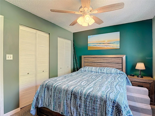 809 Bahia Del Sol Dr Unit 72, Ruskin, FL 33570 - carpeted bedroom featuring multiple closets, a textured ceiling, and ceiling fan