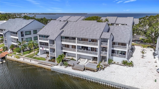 809 Bahia Del Sol Dr Unit 72, Ruskin, FL 33570 - back of house featuring roof with shingles and a water view