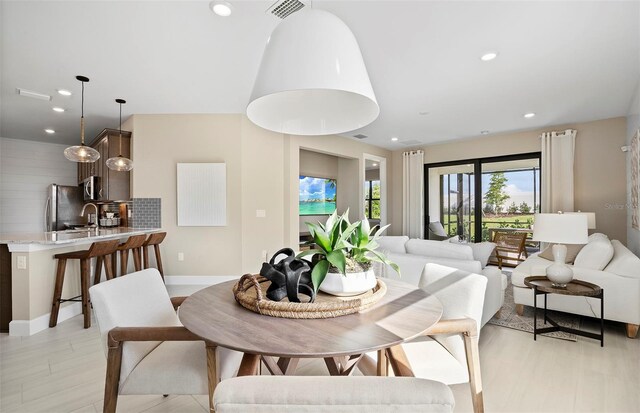 14317 Eagle Branch Dr, Nokomis, FL 34275 - dining space featuring recessed lighting and light wood finished floors