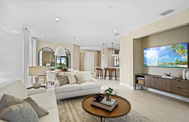 14317 Eagle Branch Dr, Nokomis, FL 34275 - living room featuring light wood-type flooring and recessed lighting