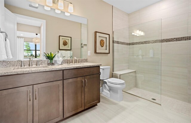 14317 Eagle Branch Dr, Nokomis, FL 34275 - full bathroom with double vanity, walk in shower, and tile patterned flooring