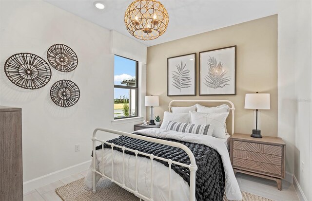 14317 Eagle Branch Dr, Nokomis, FL 34275 - bedroom featuring a chandelier and baseboards