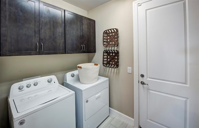 14317 Eagle Branch Dr, Nokomis, FL 34275 - washroom featuring cabinet space, washer and clothes dryer, and light tile patterned flooring