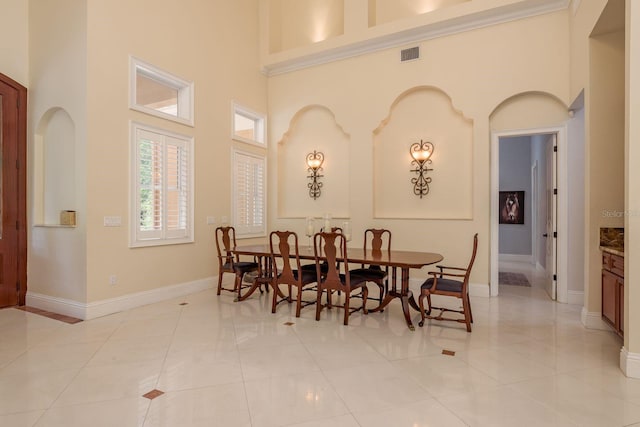 11430 Trotting Down Dr, Odessa, FL 33556 - dining area featuring a towering ceiling and light tile patterned floors