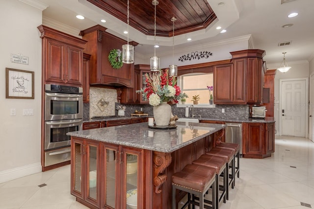 11430 Trotting Down Dr, Odessa, FL 33556 - kitchen featuring stainless steel appliances, a warming drawer, ornamental molding, backsplash, and a center island