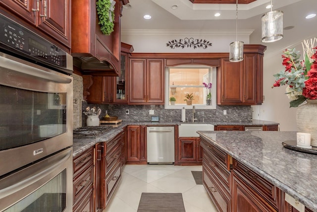 11430 Trotting Down Dr, Odessa, FL 33556 - kitchen featuring backsplash, crown molding, dark stone counters, pendant lighting, and appliances with stainless steel finishes