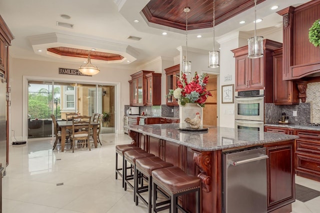 11430 Trotting Down Dr, Odessa, FL 33556 - kitchen with a tray ceiling, appliances with stainless steel finishes, crown molding, dark brown cabinets, and tasteful backsplash