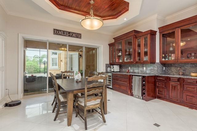 11430 Trotting Down Dr, Odessa, FL 33556 - dining space featuring beverage cooler, a tray ceiling, light tile patterned flooring, wood ceiling, and ornamental molding