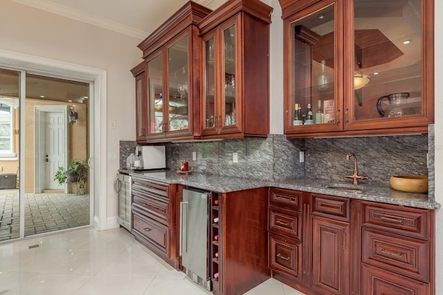 11430 Trotting Down Dr, Odessa, FL 33556 - indoor wet bar with decorative backsplash, ornamental molding, light tile patterned floors, wine cooler, and fridge