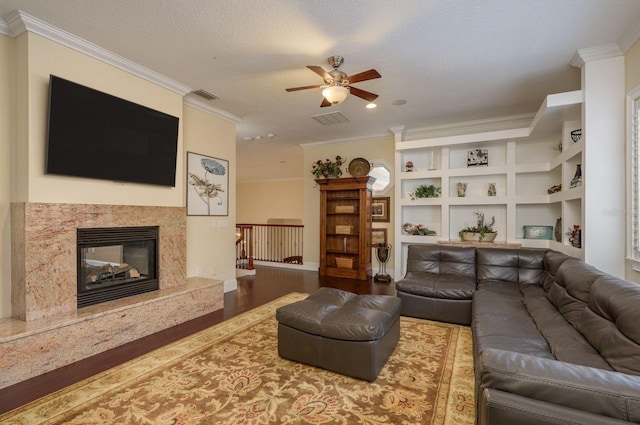 11430 Trotting Down Dr, Odessa, FL 33556 - living room with a ceiling fan, wood finished floors, ornamental molding, and a high end fireplace