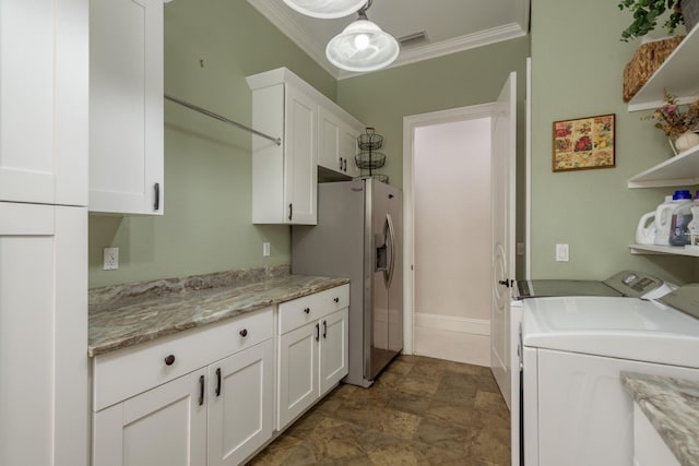 11430 Trotting Down Dr, Odessa, FL 33556 - laundry room featuring independent washer and dryer, cabinet space, and ornamental molding