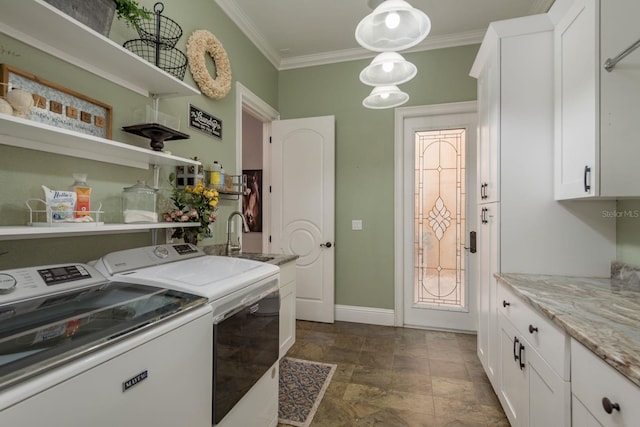 11430 Trotting Down Dr, Odessa, FL 33556 - laundry area featuring washing machine and clothes dryer, cabinet space, crown molding, and stone finish floors