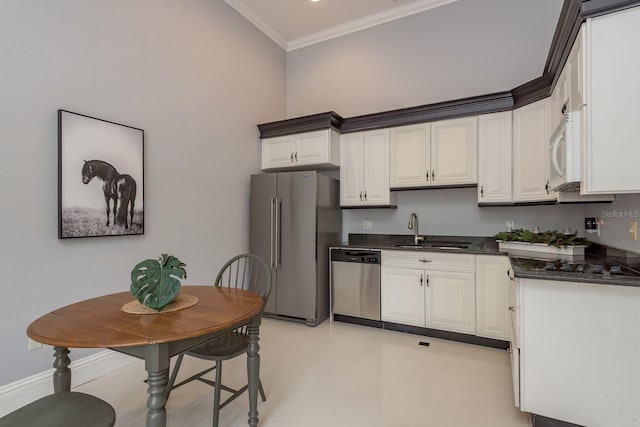 11430 Trotting Down Dr, Odessa, FL 33556 - kitchen featuring appliances with stainless steel finishes, ornamental molding, white cabinetry, and light tile patterned floors