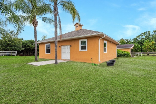 11430 Trotting Down Dr, Odessa, FL 33556 - back of house with stucco siding, a patio area, and a shingled roof