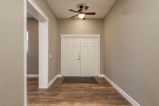 11430 Trotting Down Dr, Odessa, FL 33556 - foyer featuring a ceiling fan, dark wood-style floors, and a textured wall