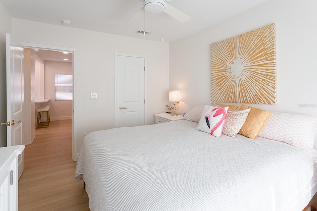 434 77th Ave, St Pete Beach, FL 33706 - bedroom featuring light wood finished floors and a ceiling fan