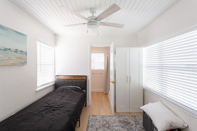 434 77th Ave, St Pete Beach, FL 33706 - bedroom featuring wooden ceiling, light wood-style floors, and ceiling fan
