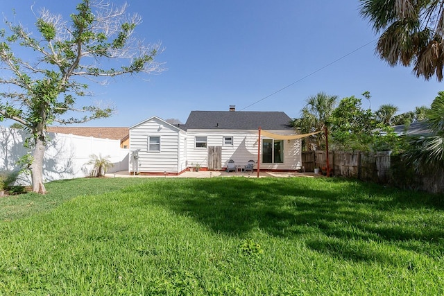 434 77th Ave, St Pete Beach, FL 33706 - rear view of house with a fenced backyard and a patio
