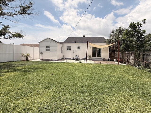 434 77th Ave, St Pete Beach, FL 33706 - rear view of house with a patio and a fenced backyard
