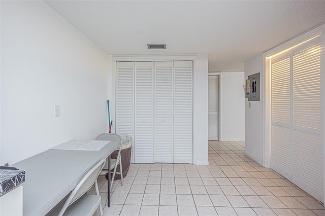 14820 Rue De Bayonne Unit 301, Clearwater, FL 33762 - office space featuring light tile patterned floors and electric panel