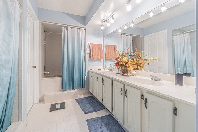 14820 Rue De Bayonne Unit 301, Clearwater, FL 33762 - bathroom with tile patterned floors, double vanity, and shower / bath combo