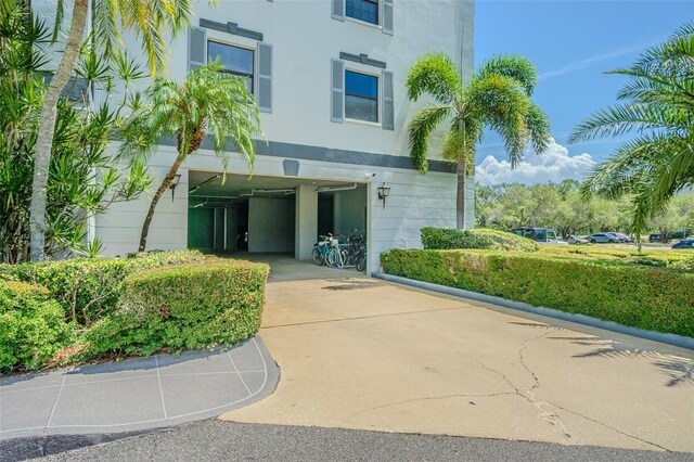 14820 Rue De Bayonne Unit 301, Clearwater, FL 33762 - view of property featuring driveway