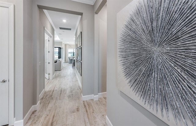 6162 Winding Pine Dr, Nokomis, FL 34275 - hall featuring ornamental molding, wood finished floors, and recessed lighting