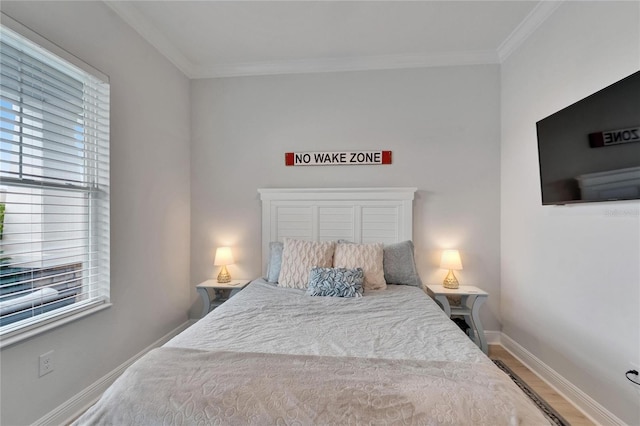5971 Hidden Branch Dr, Apollo Beach, FL 33572 - bedroom with multiple windows, ornamental molding, and wood finished floors