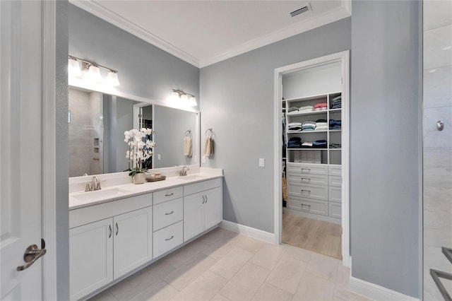 5971 Hidden Branch Dr, Apollo Beach, FL 33572 - full bath with crown molding, double vanity, a spacious closet, and tiled shower